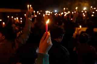 A candlelight vigil condemning crimes against women. (Virendra Singh Gosain/Hindustan Times via Getty Images)