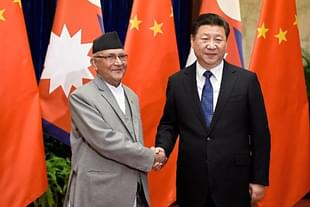 Chinese President Xi Jinping (R) shakes hands with Nepal Prime Minister Khadga Prasad Sharma Oli (L) (Etienne Oliveau/Getty Images)