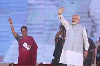 Prime Minister Narendra Modi and Rajasthan Chief Minister Vasundhara Raje at a public rally at the launch of National Nutrition Mission, on March 8, 2018 in Jhunjhunu. (Himanshu Vyas/Hindustan Times via Getty Images)