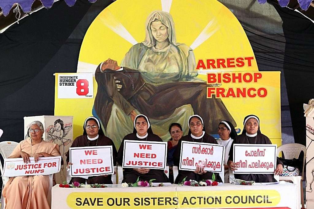Nuns hold placards during a protest demanding justice after an alleged rape of a nun by a bishop. (Vivek Nair/Hindustan Times via Getty Images)