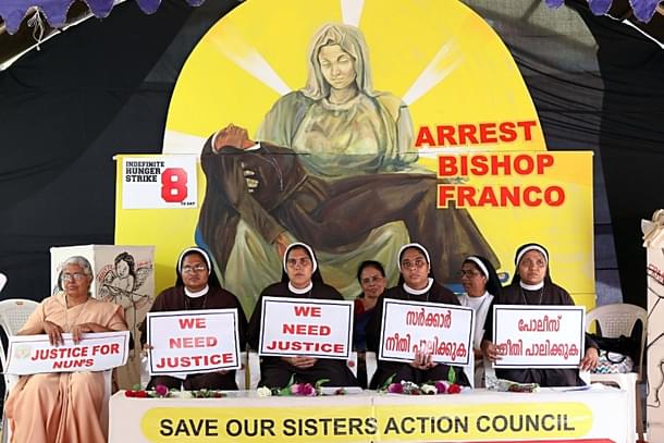 Nuns hold placards during a protest demanding justice after an alleged sexual assault of a nun by a bishop. (Vivek Nair/Hindustan Times via Getty Images)