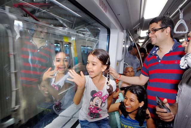Children and their parents enjoy the Mumbai Metro ride. (Kalpak Pathak/Hindustan Times via Getty Images)