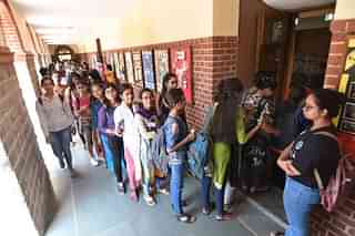 Students wait to cast their vote during the Delhi University Students Union (DUSU)(Photo by Sushil Kumar/Hindustan Times via Getty Images)
