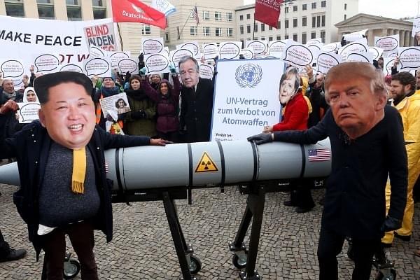 Activists wearing masks of Kim Jong Un (L) and Donald Trump (R) protesting in Berlin against nuclear escalations in Korean Peninsula. (Adam Berry via Getty Images)