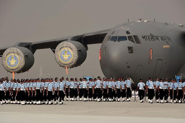 Indian Air Force personnel march past a C-17 Globemaster during the Air Force Day parade on theoutskirts of New Delhi. (MONEY SHARMA/AFP/GettyImages)