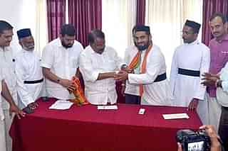 Father Geevargheese Kizhakkedath and Father Thomas Kulathungal joining BJP being greeted by PS Sreedharan Pillai, BJP Chief of Kerala Unit.(Pic:Twitter)