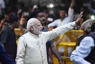 Prime Minister Narendra Modi waves to his supporters. (Ajay Aggarwal/Hindustan Times via Getty Images)&nbsp;