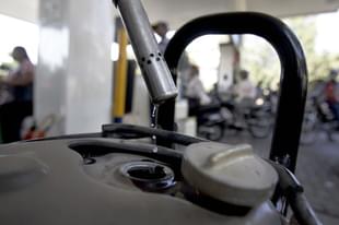 Bikers fill petrol on a fuel station in Kandivali near Mumbai. (Prasad Gori/Hindustan Times via GettyImages)