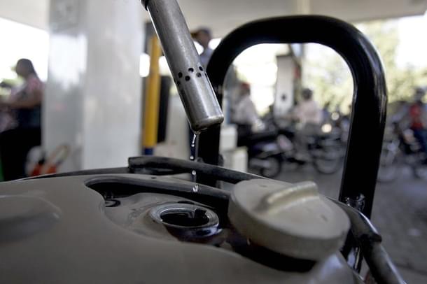Bikers fill petrol on a fuel station in Kandivali near Mumbai. (Prasad Gori/Hindustan Times via GettyImages)