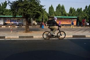 Man cycling in Delhi (Priyanka Parashar/Mint via Getty Images) 
