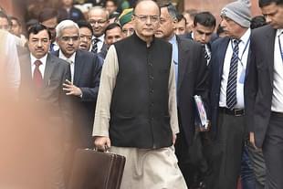 Finance Minister Arun Jaitley (C) leaves his office for the General Budget (Photo by Raj K Raj/Hindustan Times via Getty Images)