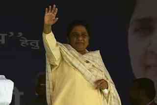 BSP leader Mayawati waves to the crowd upon her arrival at an election rally. (MONEY SHARMA/AFP/Getty Images)