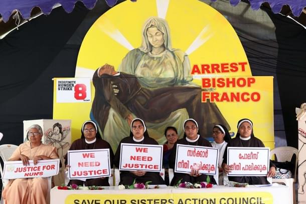 Nuns hold placards during a protest demanding justice after an alleged sexual assault of a nun by a bishop in Kochi, Kerala  (Vivek Nair/Hindustan Times via Getty Images) 