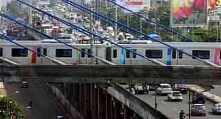Metro train parked on the cable bridge crossing Western Express Highway over Andheri Flyover in Mumbai, India, on Thursday, Aug. 8, 2013. (Photo by Mahendra Parikh/Hindustan Times via Getty Images)&nbsp;