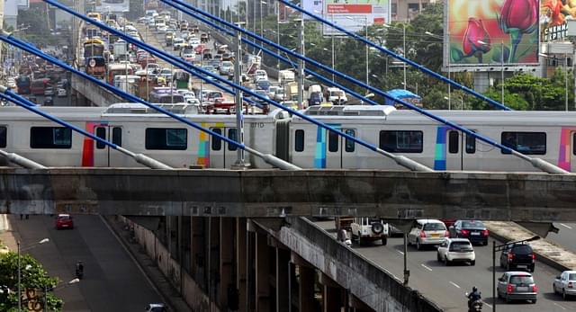 Metro train parked on the cable bridge crossing Western Express Highway over Andheri Flyover in Mumbai, India, on Thursday, Aug. 8, 2013. (Photo by Mahendra Parikh/Hindustan Times via Getty Images)&nbsp;