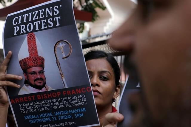  People hold a protest against Bishop Franco Mulakkal for his arrest outside the Kerala House. (Biplov Bhuyan/Hindustan Times via Getty Images)