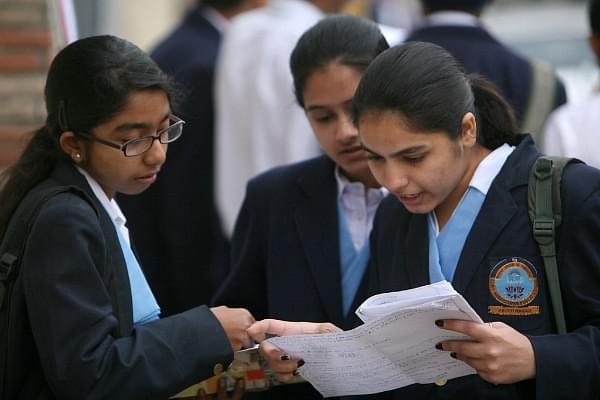 Grade XII students rivising in the last minute outside their examination centres (Shekhar Yadav/India Today Group/Getty Images)