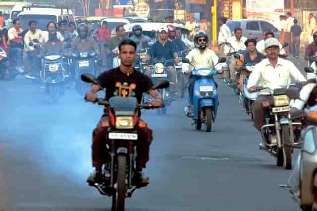Scooters and bikes pollution on road in Pune, India. (Sandesh Bhandare/The India Today Group/Getty Images)
