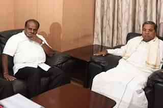 Karnataka CM H D Kumaraswamy with former CM Siddaramaiah. (Photo by Arijit Sen/Hindustan Times via Getty Images)