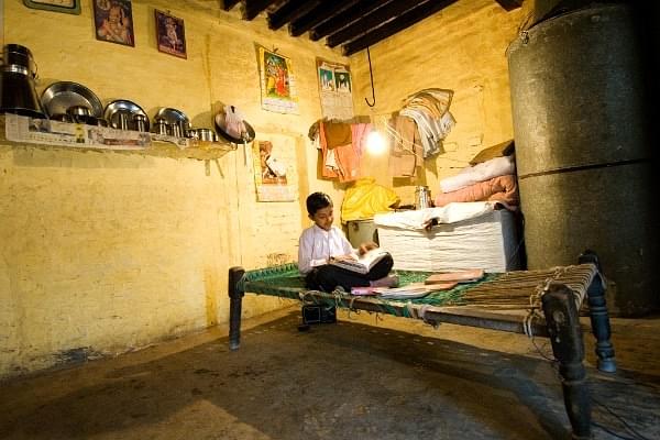 A child studying under lights (Priyanka Parashar/Mint via Getty Images)
