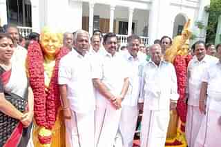 AIADMK leaders with statues dedicated to former leaders J Jayalalitha and MGR.&nbsp;