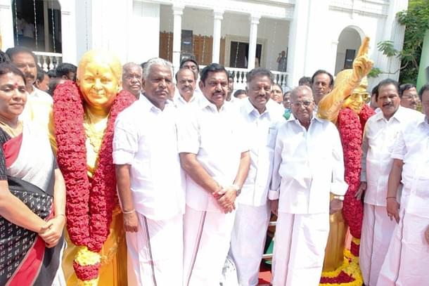 AIADMK leaders with statues dedicated to former leaders J Jayalalitha and MGR. 