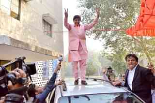 Lieutenant Governor Kiran Bedi standing on a car after casting vote in New Delhi (K Asif/India Today Group/Getty Images)