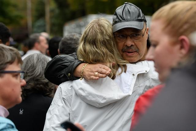 People comfort each other at the site of a mass shooting at the Tree of Life Synagogue in the Squirrel Hill neighbourhood on October 27, 2018 in Pittsburgh, Pennsylvania. (Photo by Jeff Swensen/Getty Images)