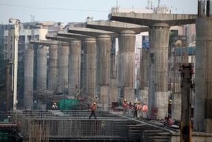 Workers wrapping up work at the Metro rail site in Andheri as the projects near completion in February, 2011 (Photo by Sattish Bate/Hindustan Times via Getty Images)
