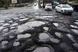 Potholes on road (Photo by Bachchan Kumar/Hindustan Times via Getty Images)