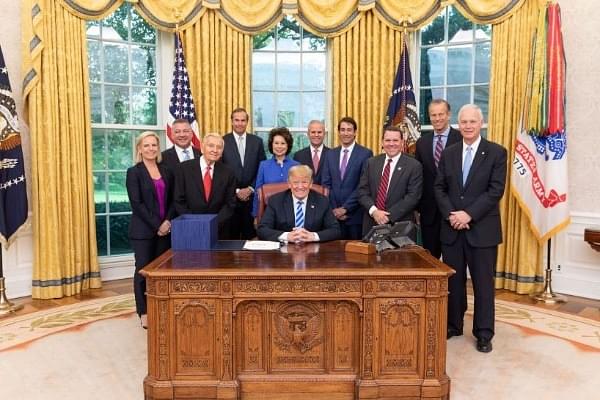US President Donald Trump and others pose after passing the Build Act which makes provisions for funds to counter BRI (@opicgov/Twitter)
