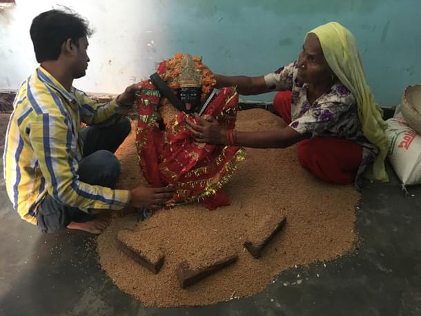 (Right) Bedo Devi with the Kali idol