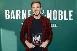PewDiePie with his book ‘This Book Loves You’  (Photo by John Lamparski/Getty Images)