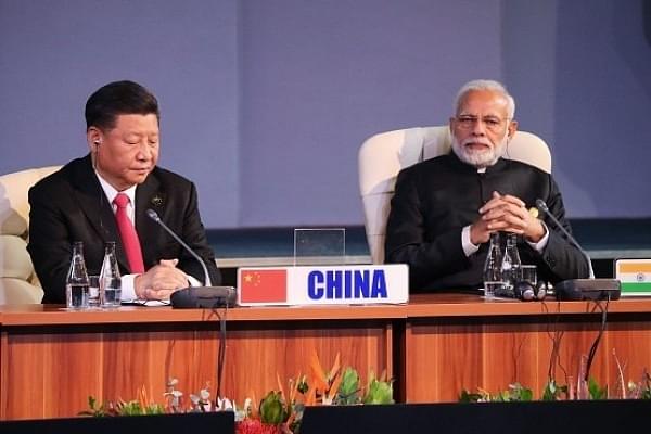 Chinese President Xi Jinping and Indian PM Narendra Modi  (Photo: MIKE HUTCHINGS/AFP/Getty Images)