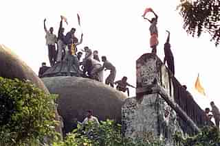 Hindu youth demolishing the disputed structure in Ayodhya. 