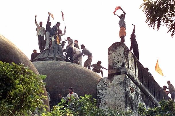 Hindu youth demolishing the disputed structure in Ayodhya.