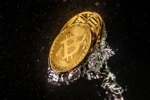 A visual representation of the digital currency Bitcoin sinks into water. (Dan Kitwood/Getty Images)