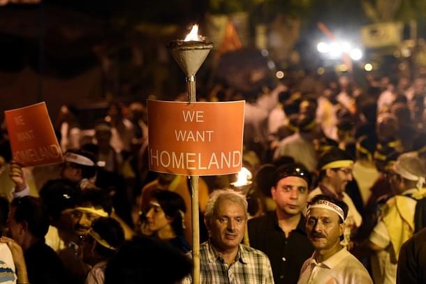 Kashmiri Pandits  hold a massive rally on the occasion of World Refugee Day, demanding a separate homeland within Kashmir at Jantar Mantar  in New Delhi. (Vipin Kumar/Hindustan Times via GettyImages) 