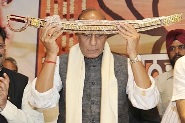 Rajnath SIngh holding a ceremonial sword (Representative image) (Munish Byala/Hindustan Times via Getty Images)