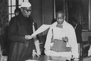 Indian President Rajendra Prasad (left) swearing in new cabinet minister Sardar Vallabhbhai Patel as India becomes a republic, January 30th 1950. (Fox Photos/Hulton Archive/Getty Images)