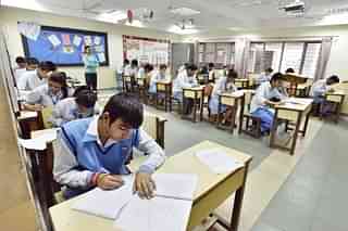Class XII students writing an exam (Sanjeev Verma/Hindustan Times via Getty Images)