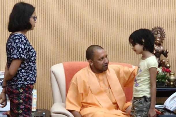 UP Chief Minister Yogi Adityanath with the murdered Apple executive’s family. (pic via Twitter)