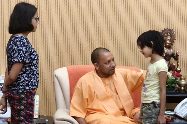 UP Chief Minister Yogi Adityanath with the murdered Apple executive’s family. (pic via Twitter)