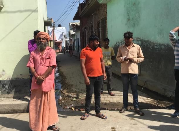 (Left) Pujari Mukesh Giri who offered the temple he manages for the idol