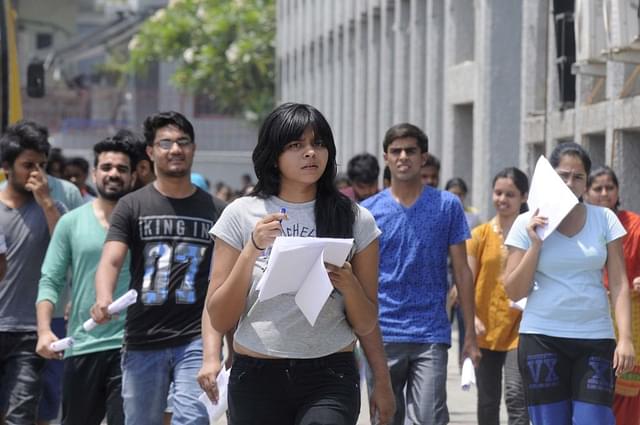 Students coming out after appearing for NEET exam. (Sunil Ghosh/Hindustan Times via Getty Images)