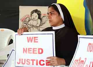 Nuns hold placards during a protest demanding justice after an alleged sexual assault by Bishop Mulakkal. (Vivek Nair/Hindustan Times via Getty Images)
