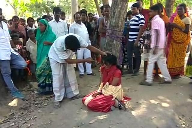 Girl tied to a tree for loving a Hindu boy (@ANI/Twitter)