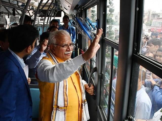 Haryana Chief Minister M L Khattar with other officials after inaugurating the Gurugram Metropolitan City Bus services, in September, in Gurugram, India. (Yogendra Kumar/Hindustan Times via GettyImages)&nbsp;