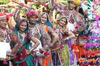 Men and women performing dandiya at the Navratri festival in Ahmedabad, Gujarat. (Shailesh Raval/The India Today Group/GettyImages)