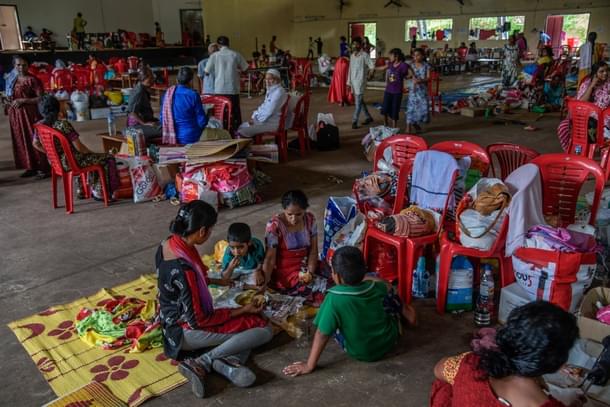 People rest at a relief camp in Aluva on 22 August 2018 in Kerala, India. (Atul Loke/GettyImages) 
